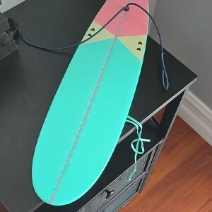 Colorful Surfboard with Pink and Teal Design